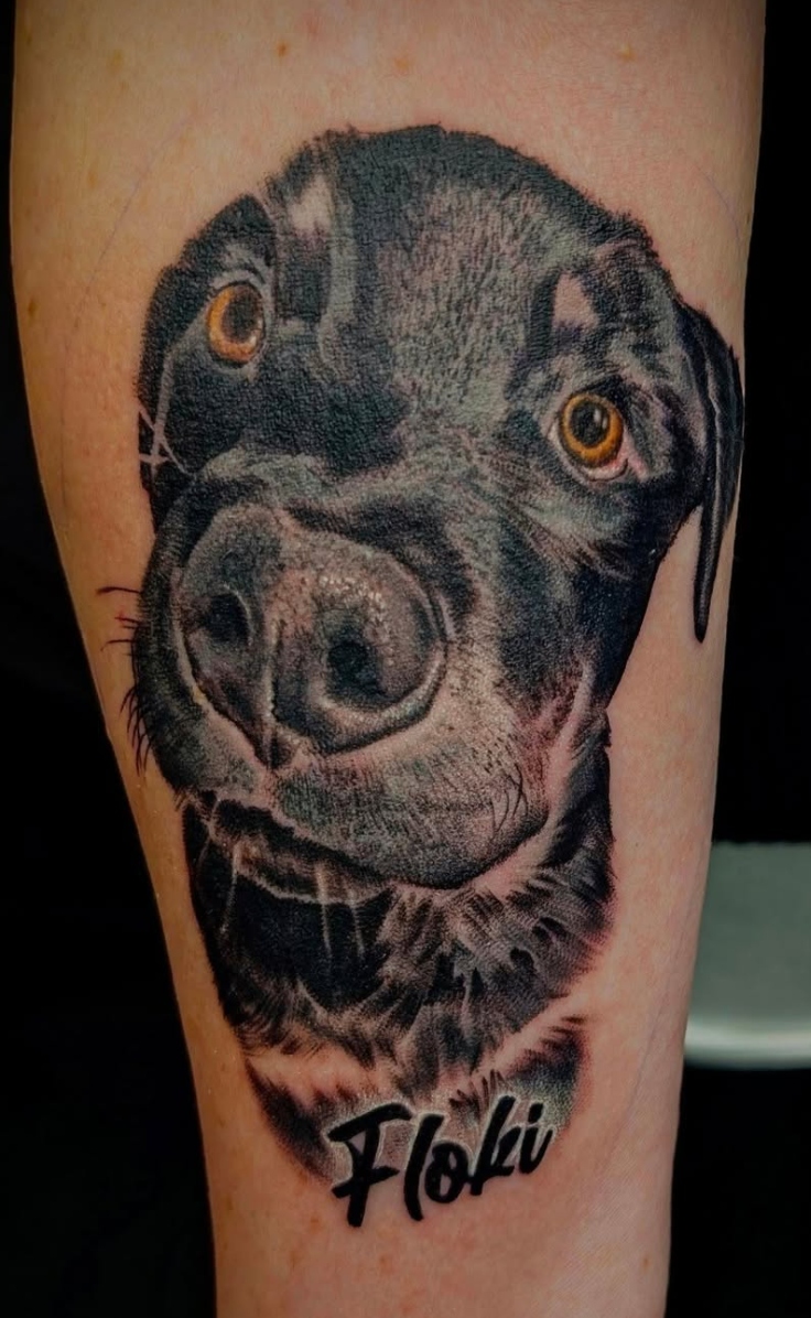Black and gray realism dog portrait tattoo with soft fur shading by a Final Touch Tattoo artist