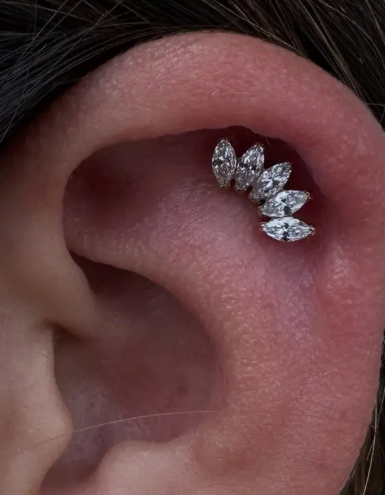 Ear piercing by Kara